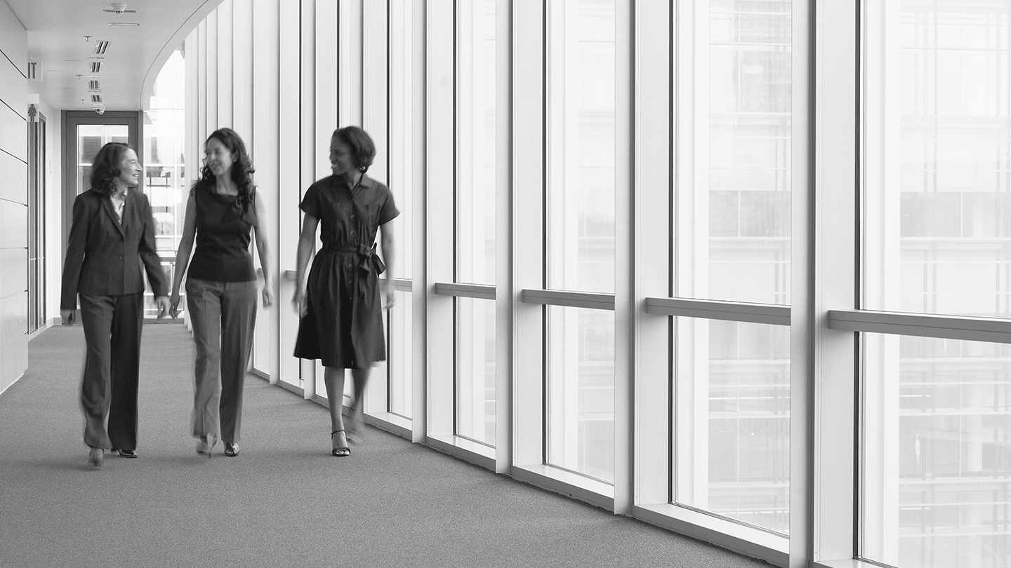 Three female colleagues walking