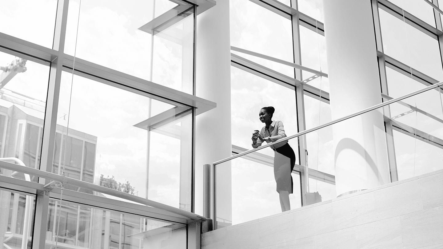 Woman leans on railing