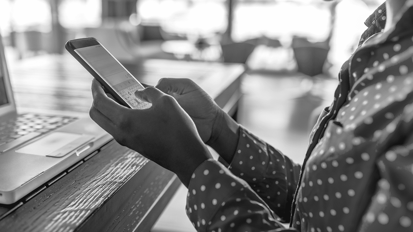 Woman typing on phone