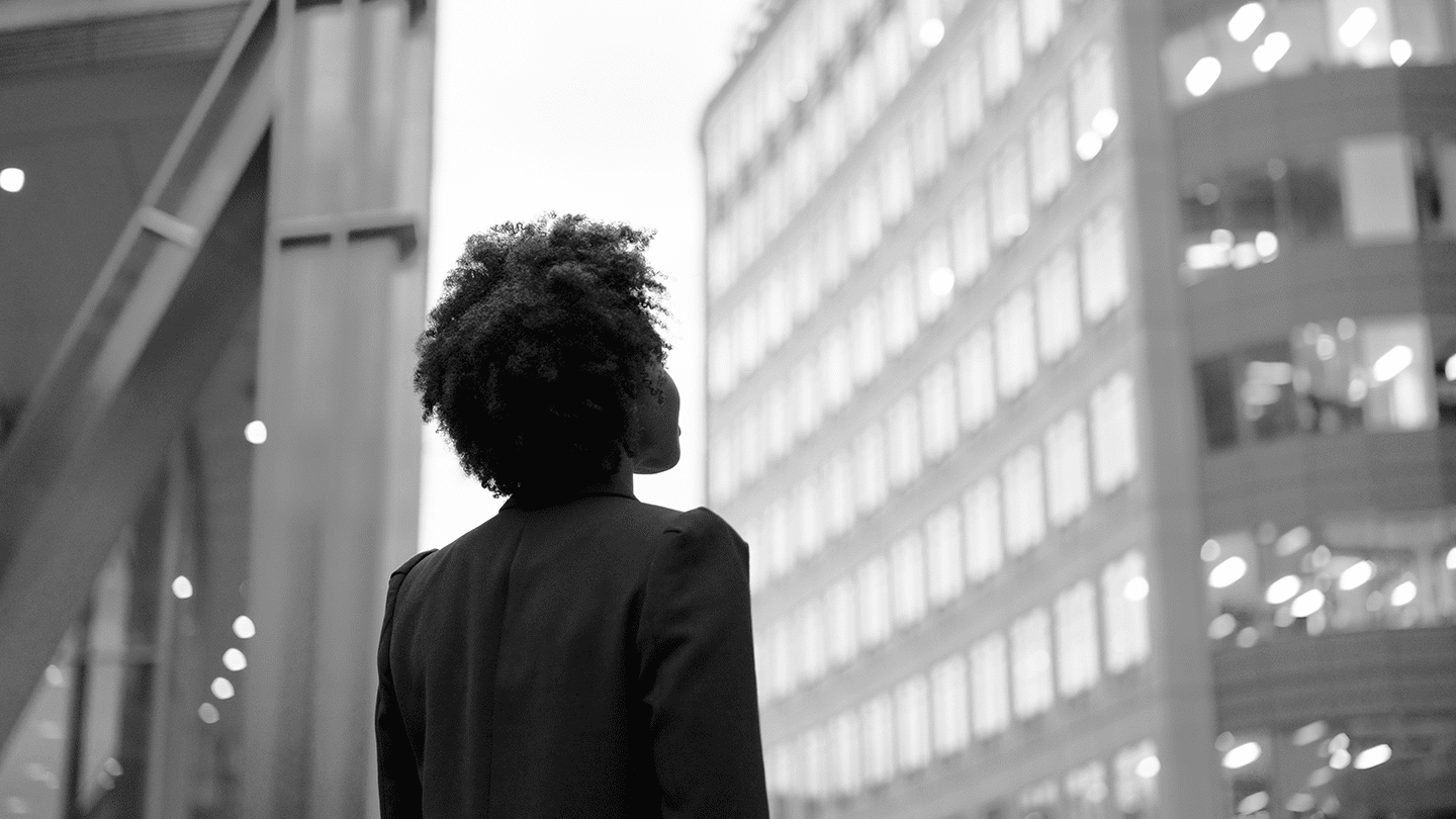 Woman looks at building