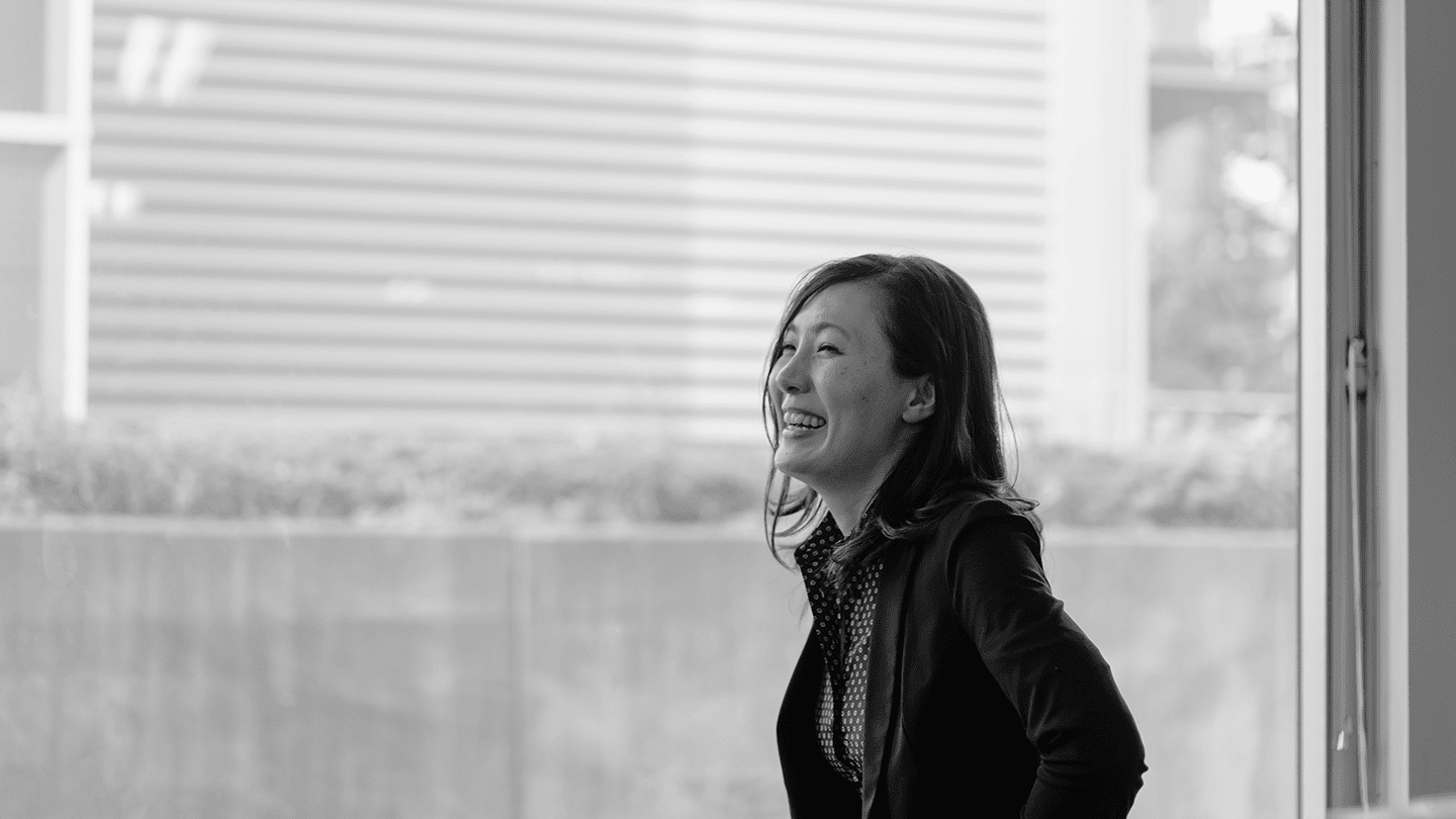 Woman laughing by window