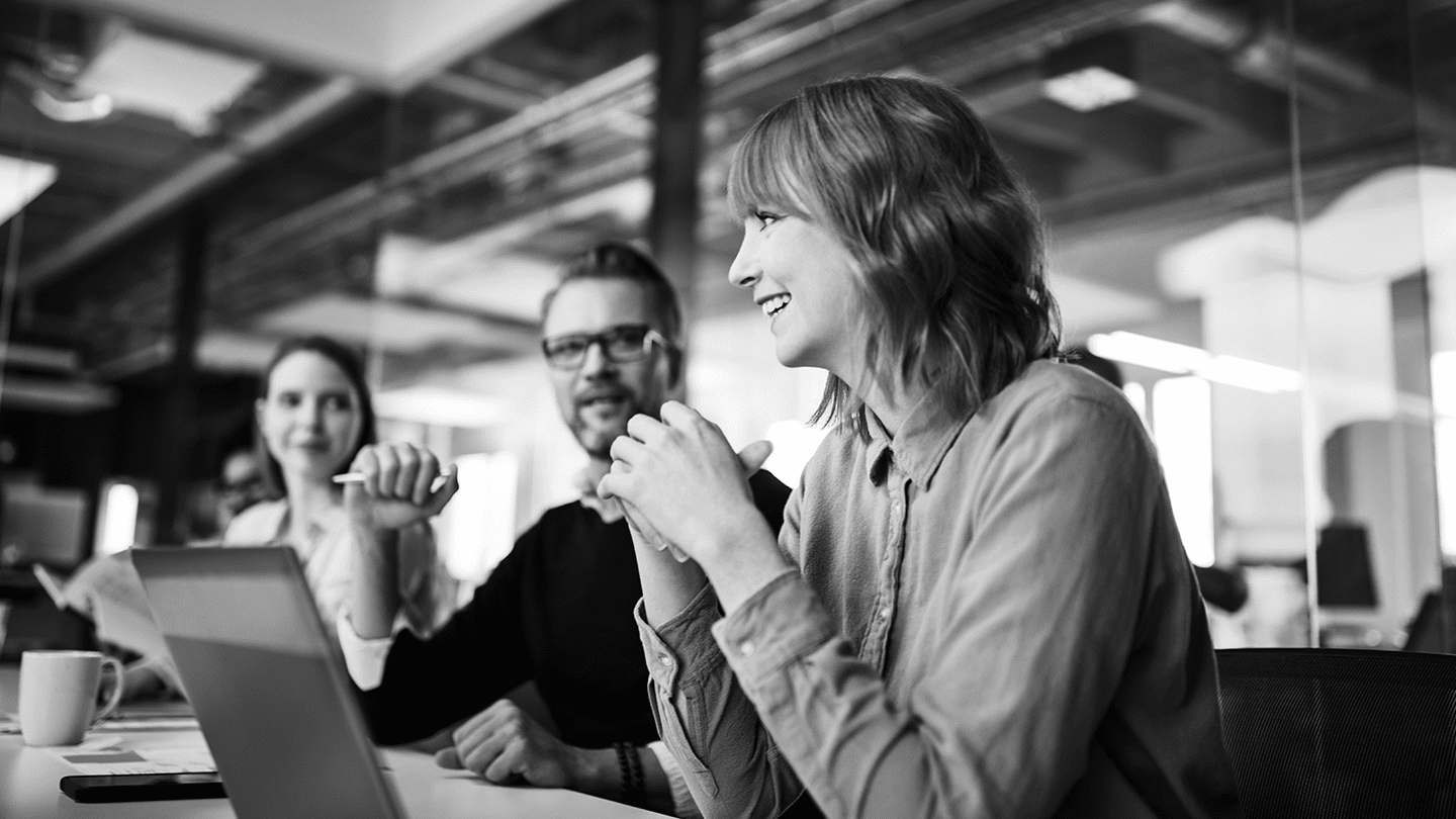 colleagues smiling during a discussion