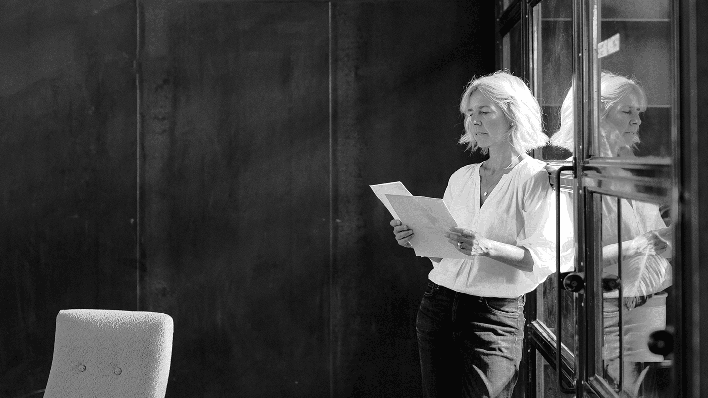 Woman reading documents in an office