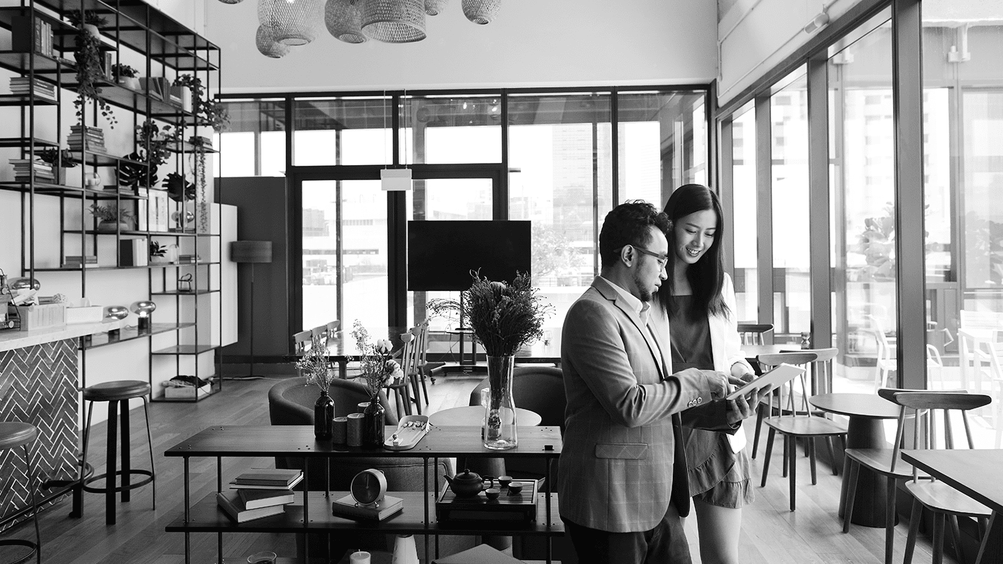 Female and male colleague in an office